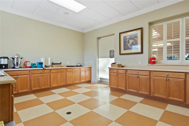 kitchen with light tile patterned flooring