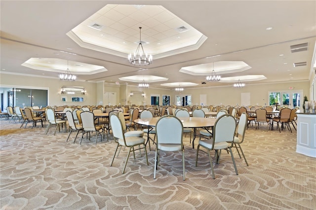 carpeted dining area featuring an inviting chandelier, crown molding, and a tray ceiling