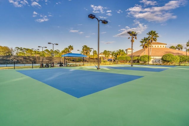 view of tennis court featuring a gazebo