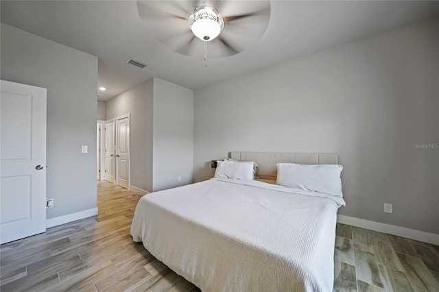 bedroom featuring ceiling fan and light hardwood / wood-style floors