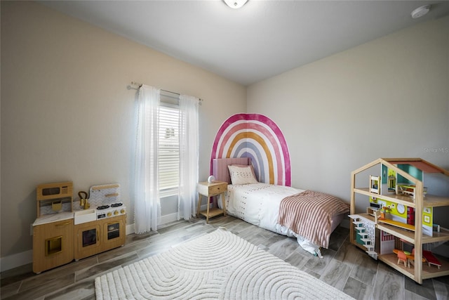 bedroom featuring hardwood / wood-style flooring