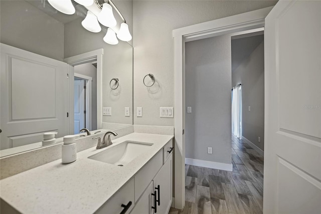 bathroom featuring vanity and hardwood / wood-style flooring