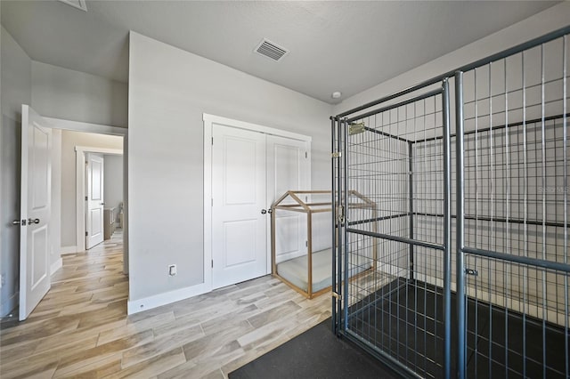 interior space featuring a closet and hardwood / wood-style floors