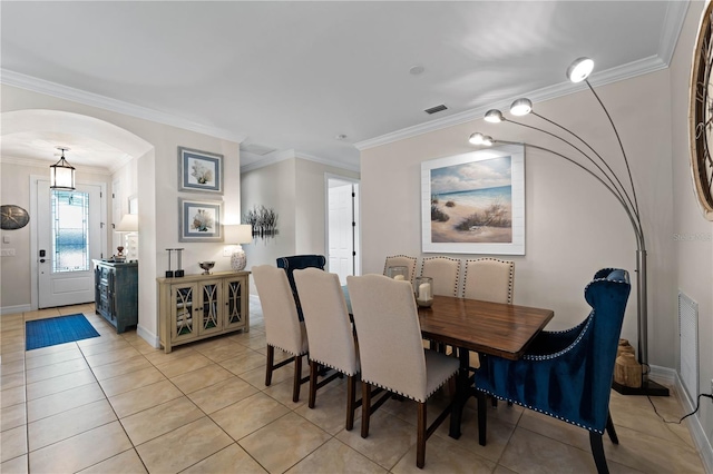 tiled dining space with crown molding