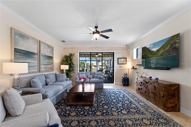 living room with ceiling fan and ornamental molding