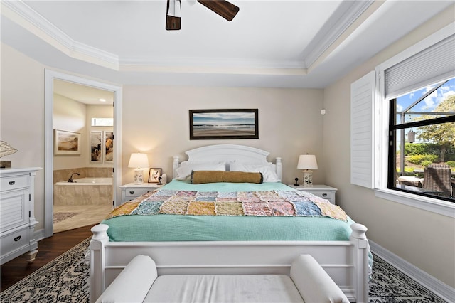 bedroom featuring ceiling fan, hardwood / wood-style flooring, crown molding, and ensuite bathroom