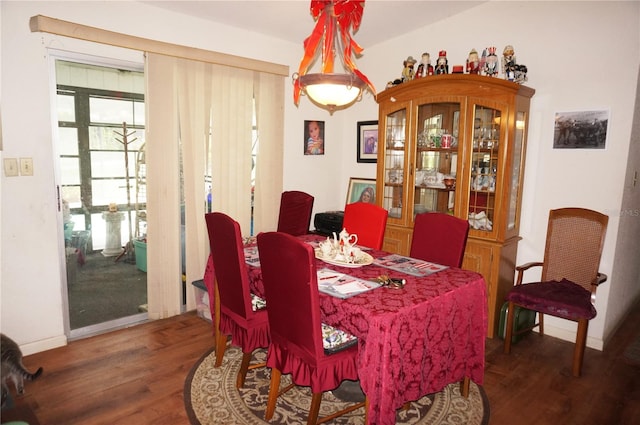 dining area with dark wood-type flooring