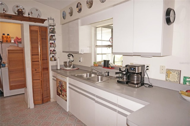 kitchen with white cabinetry and sink