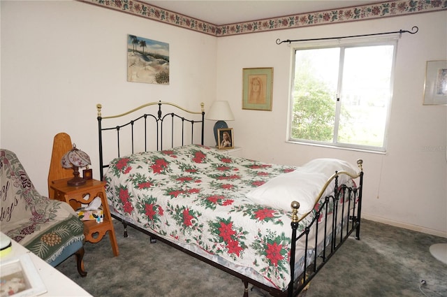 bedroom featuring dark colored carpet