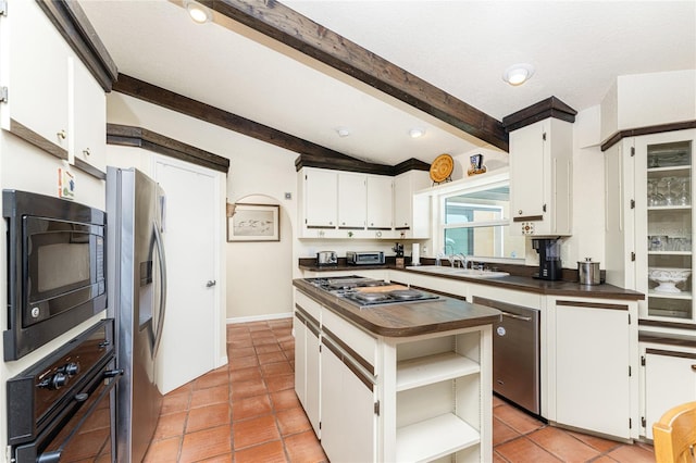 kitchen featuring black appliances, light tile patterned floors, sink, white cabinetry, and vaulted ceiling with beams