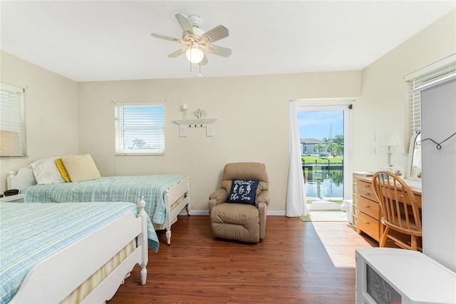 bedroom with dark wood-type flooring and ceiling fan