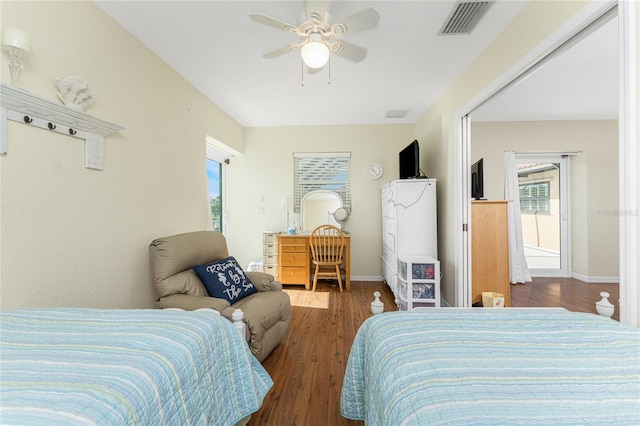 bedroom with dark wood-type flooring and ceiling fan