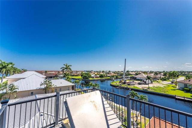 balcony featuring a water view