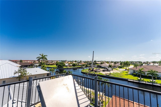 balcony featuring a water view