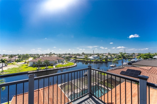 balcony featuring a water view