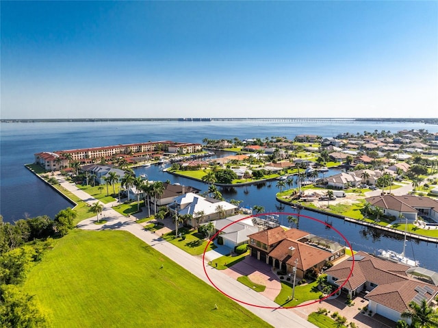 bird's eye view with a water view