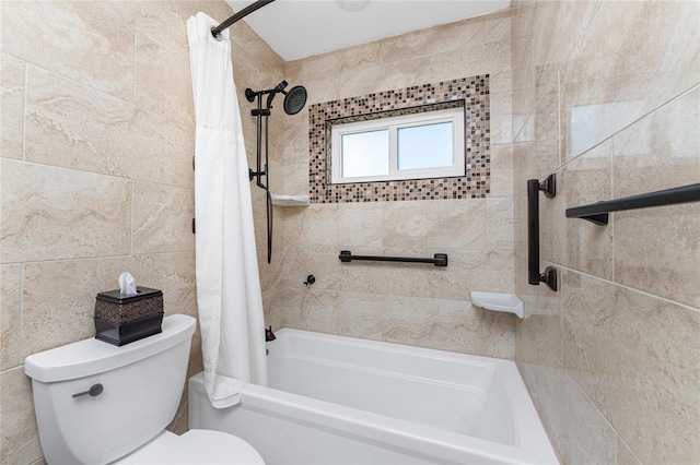 bathroom featuring tile walls, toilet, and shower / bathtub combination with curtain