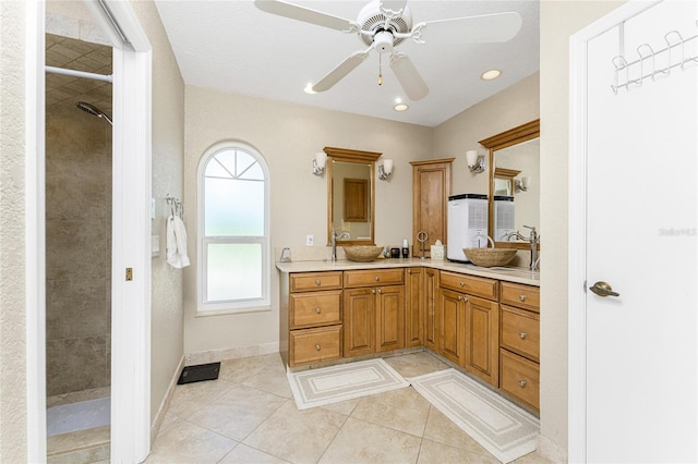 bathroom featuring vanity, plenty of natural light, ceiling fan, and tile patterned floors