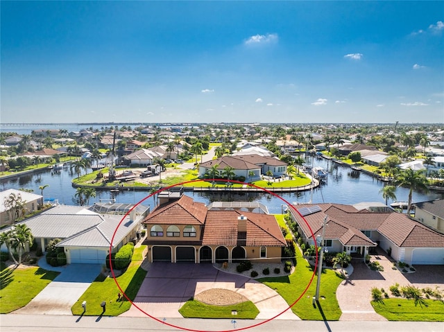 birds eye view of property featuring a water view