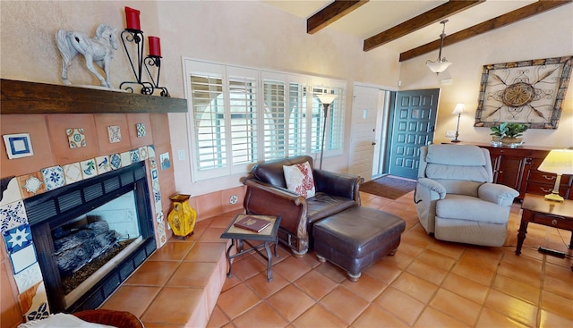 living room with lofted ceiling with beams, tile patterned flooring, and a tile fireplace