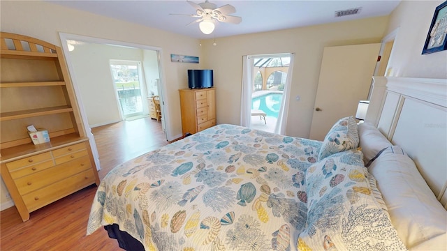 bedroom with ceiling fan and light wood-type flooring