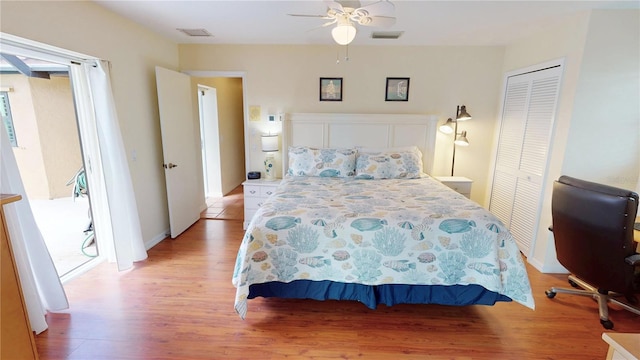 bedroom featuring ceiling fan, a closet, and light wood-type flooring