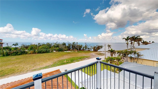 balcony featuring a water view