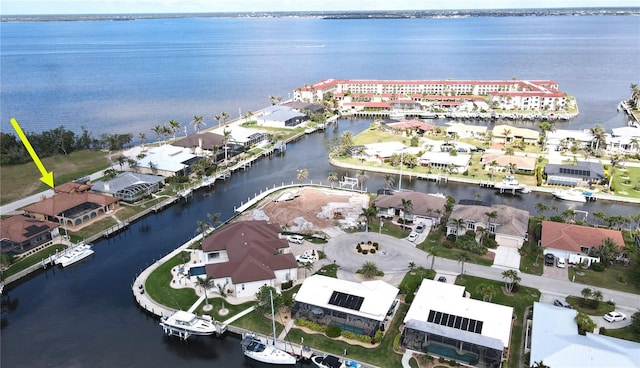 birds eye view of property with a water view