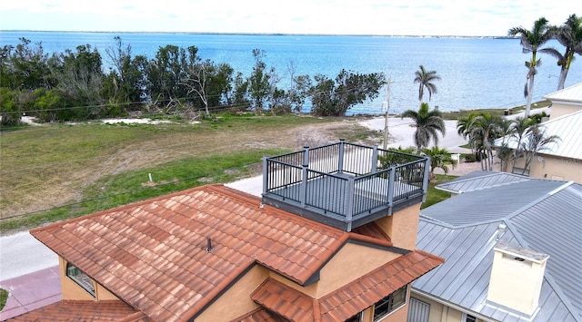 birds eye view of property with a water view