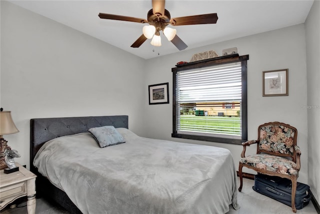 bedroom featuring a ceiling fan and light colored carpet