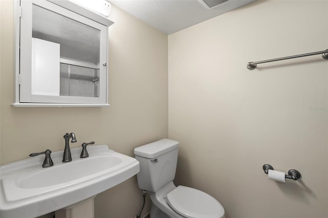 bathroom with toilet and sink