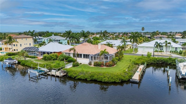 bird's eye view featuring a water view and a residential view