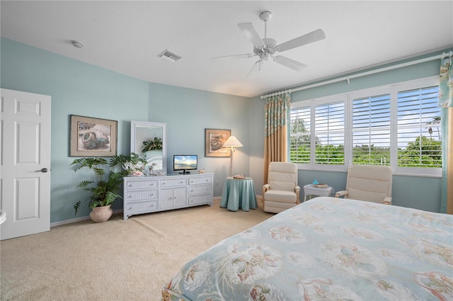 bedroom featuring ceiling fan and light colored carpet