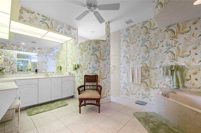 bathroom with vanity, visible vents, a bath, tile patterned floors, and wallpapered walls