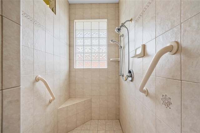 bathroom with tiled shower