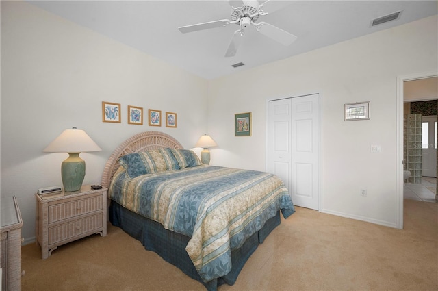 carpeted bedroom featuring a closet and ceiling fan