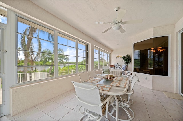 sunroom / solarium featuring ceiling fan