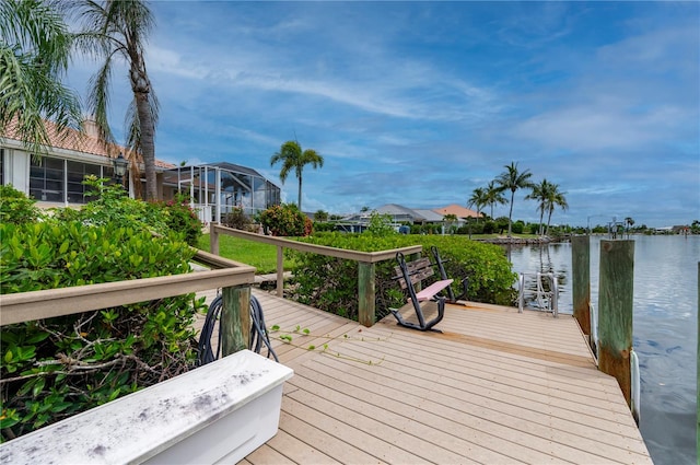 view of dock with a water view and a lanai