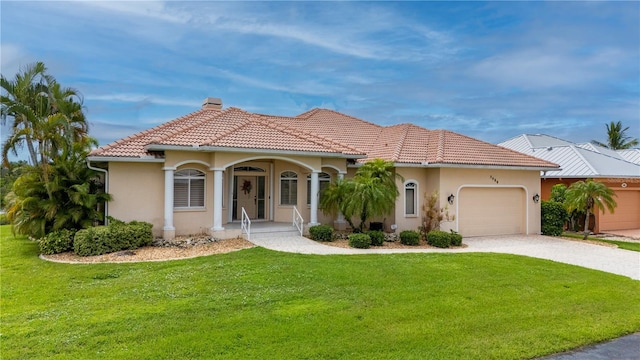 mediterranean / spanish home with a garage, a front yard, a tile roof, and stucco siding