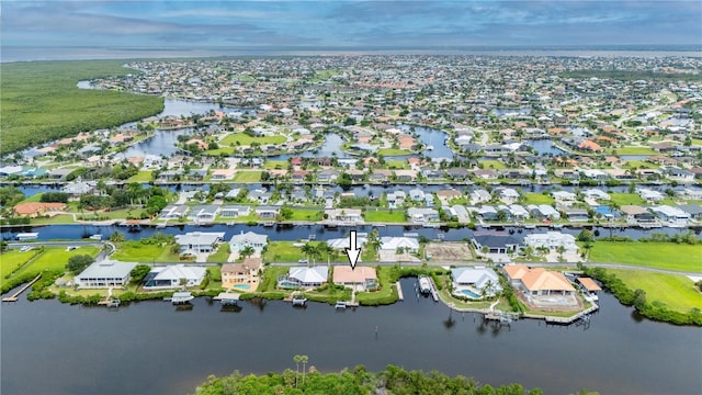 aerial view with a residential view and a water view