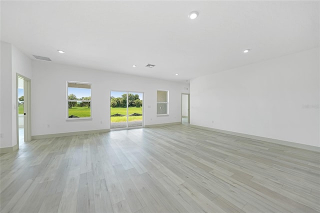 unfurnished room with light hardwood / wood-style flooring