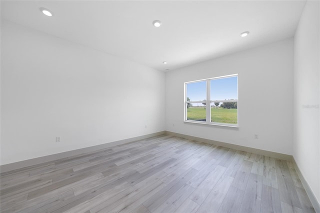 spare room with light wood-type flooring