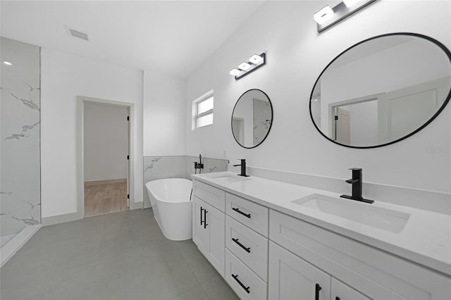 bathroom with vanity and a bathing tub