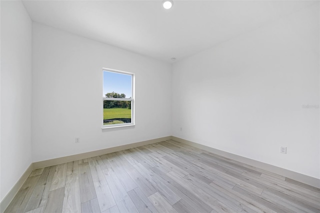 unfurnished room with light hardwood / wood-style floors