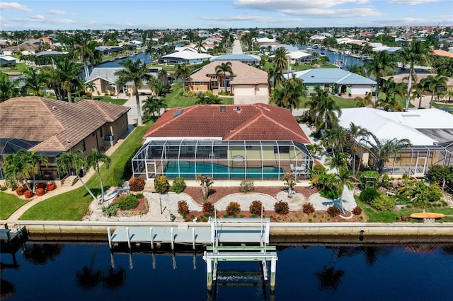 drone / aerial view with a residential view and a water view