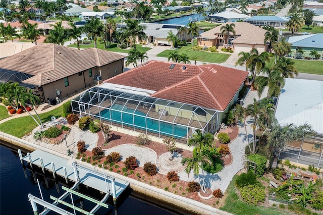 drone / aerial view featuring a water view and a residential view