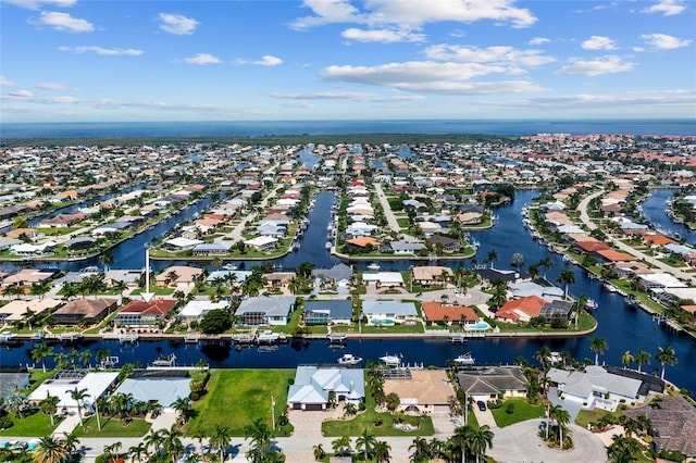 aerial view with a water view and a residential view