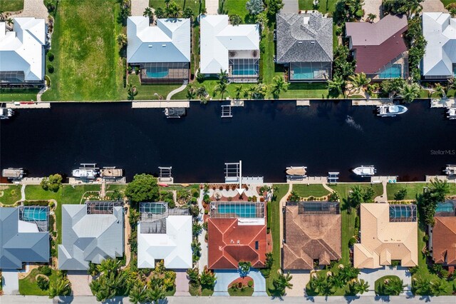 aerial view with a water view and a residential view