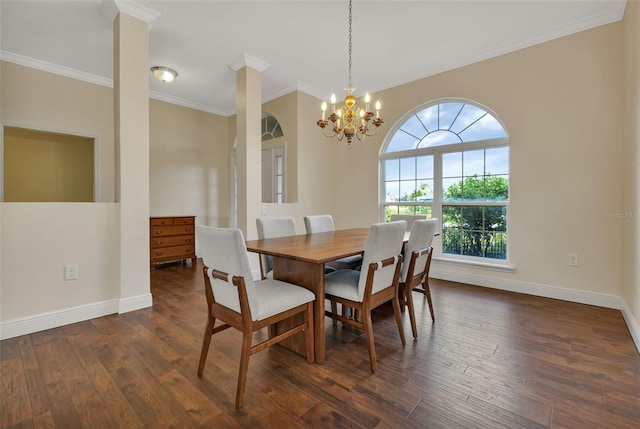 dining space with dark wood-type flooring, a notable chandelier, ornamental molding, and ornate columns