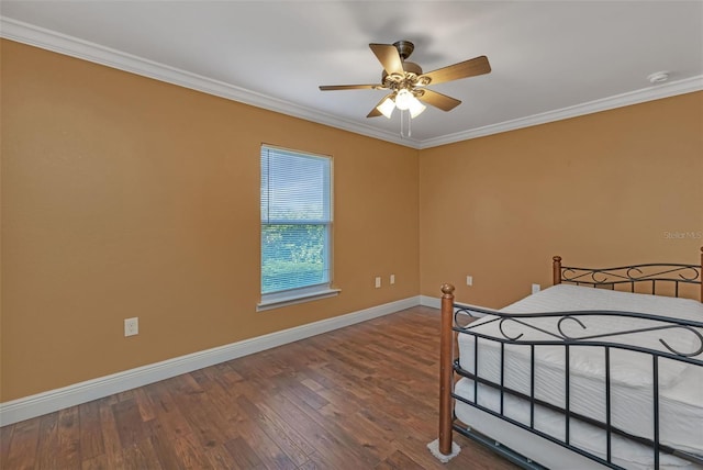 bedroom featuring crown molding, ceiling fan, and hardwood / wood-style floors